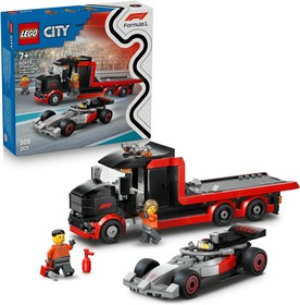 F1®-es kamion egy F1®-es Audi versenyautóval