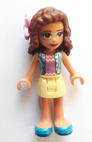 LEGO® Minifigurák frnd298 - Friends Olivia (Nougat) - Bright Light Yellow Skirt, Dark Pink Top, Blue Jacket, Flower